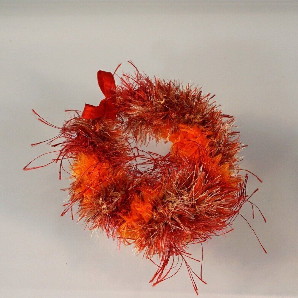 Kupee Wrist Lei Pair Red Orange Eyelash Yarn Tie-Ribbon
